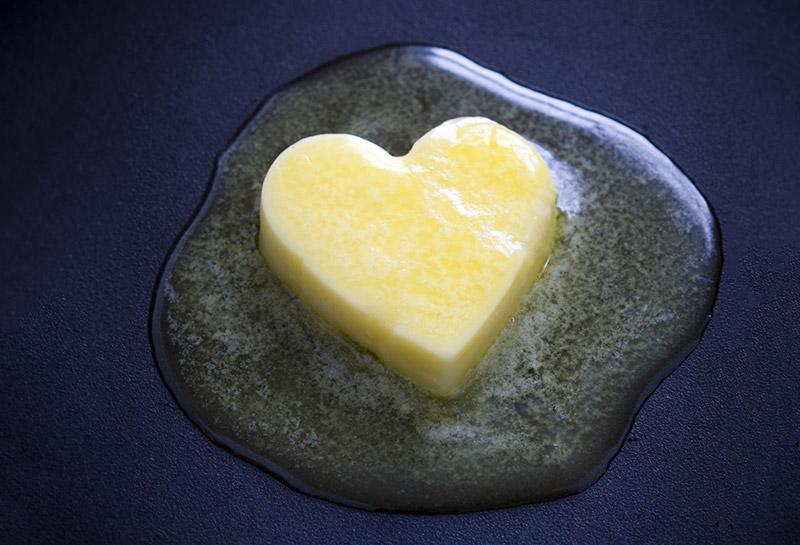 A knob of melting butter in the shape of a heart